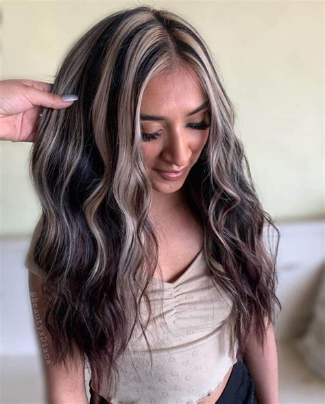 As far as this year’s hair trends are in discussion, almost none compare to rose gold. When using rose gold for peekaboo hair, you will find a highly stylish and discrete highlights choice for making blonde hair more intriguing. 33. Pastel and Bright Blend. Source.. 