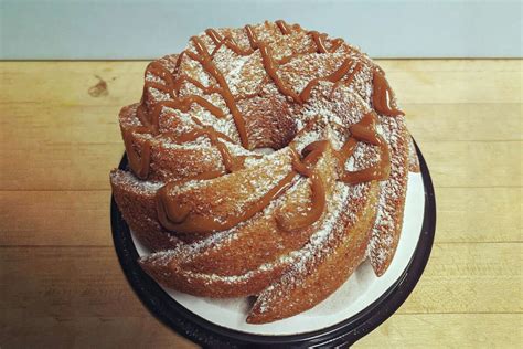 Directions: For the Cake: Preheat oven to 350 degrees F. Lightly oil a 6-cup bundt pan and set aside. In a medium mixing bowl add the sour cream, egg, vanilla, oil, butter and sugar, mix well to blend. Add the flour, baking soda, salt and mix well to incorporate.. 
