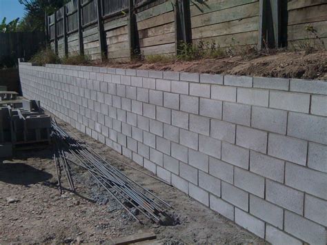 Cinder block retaining wall. Mar 17, 2022 ... Typically made from interlocking blocks, stone, or poured concrete, these walls work by protecting parts of the property from soil sliding out ... 