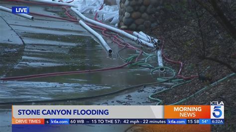 Claremont neighborhood uses sandbags, hoses to divert rising groundwater that's flooding the area