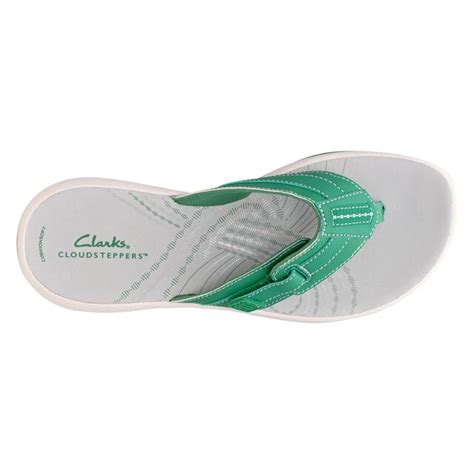 Clarks sunmaze sky sandal. Clarks Cloudsteppers Sunmaze Sky Sandal. Step into the summer in the Sunmaze Sky sandal from Cloudsteppers by Clarks. This slip-on showcases a thong strap with a contrast stitching and CushionSoft technology to provide ultimate comfort. Item # 542572; UPC # 889003117638 
