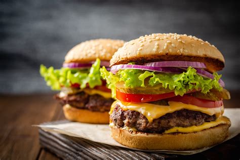 Classic burgers. Pre-heat the grill to medium heat for 5 minutes. Place hamburger patties on grill and close the lid. Cook the first side for 4 minutes. After 4 minutes, flip the burgers and cook for another 4 minutes with the lid closed. Remove from the grill and cover with aluminum foil and let rest for 5 minutes. 