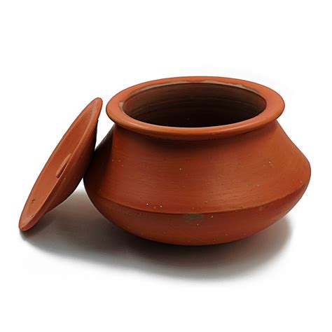 Clay handi. Importantly it is observed that food cooked in clay pots are much lower in fat than food prepared in any other pot. • Clay Handi Made of Pure Clay • Premium Quality Product • New & Elegant Design • Durable & Long Lasting • Cook Delicious & Healthy Food • Material: Clay • Diameter: 9 Inches (22 cm) • Length: 11 Inches (28 cm) 