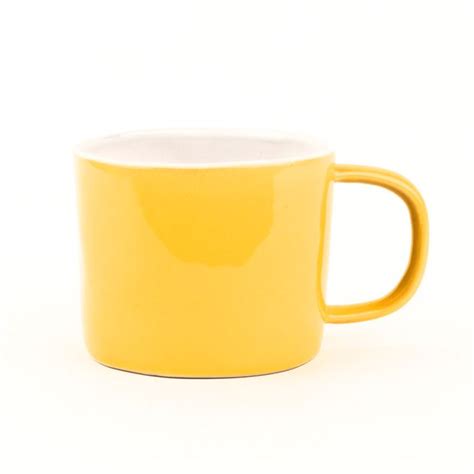 Clay mugs.  Bright yellow ceramic mug with bold "Heck Yes" script on front...