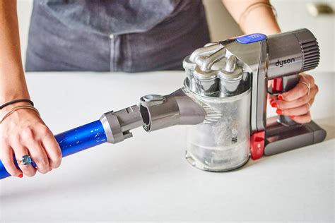 Clean dyson vacuum. For a clogged Dyson hose remove the canister and press the latch at the base of the hose to remove it. Many clogs will be at the base of the hose. If there i... 