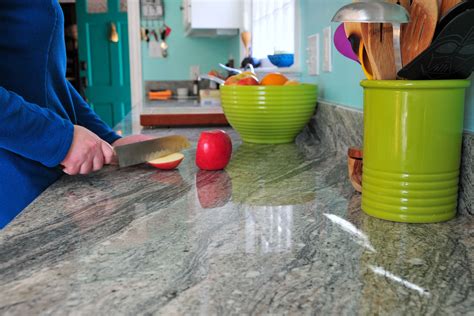 Cleaning granite countertops. Step 2: Wipe off any residue. Take a clean microfibre towel and damp it in warm water. Give your granite countertop a clean once over. This will take care of most of the dust, watermarks, food particles, beverage, and grease left standing on the surface. 