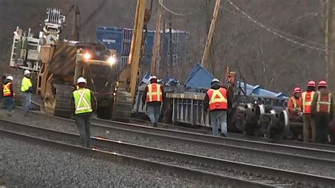 Cleanup efforts continue after freight train cars derail in Ayer
