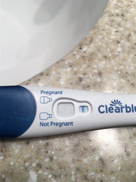 Clear blue pregnancy test faint positive line. 