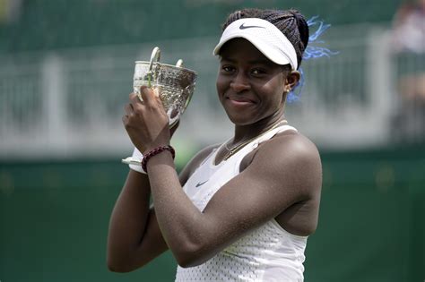 Clervie Ngounoue of the U.S. and Henry Searle of Britain win the junior singles titles at Wimbledon