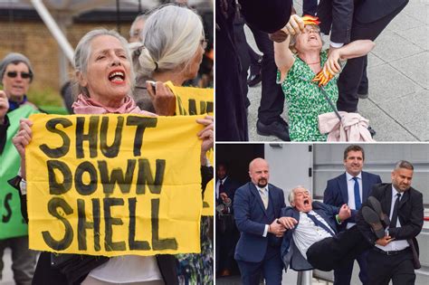 Climate protesters dragged from Shell shareholder meeting as they rush stage