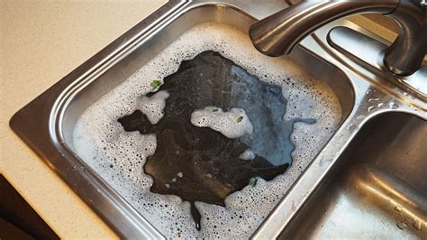 Clogged kitchen sink. Try the baking soda/vinegar method. Use a cup and bucket to bail any existing water out of your sink. Pour 1/2 cup baking soda into the drain. Use a spatula to ... 