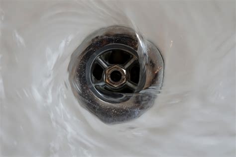 Clogged tub drain. To unclog your bathtub drain, begin by removing the drain stopper. Once you have access to the drain, insert a drain snake or auger into the drain and rotate it to grab hair and other clogs. Pull the snake out to remove clogs in upper portions of your plumbing. If this step is not enough to unclog your drain, use a plunger to help break up … 