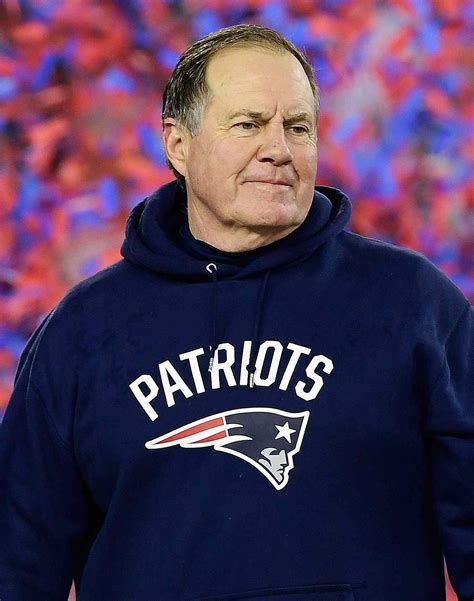 New England Patriots head coach Bill Belichick, right, embraces Bu