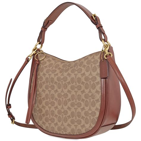 Coach hobo signature bag. This feminine bag feels like we took a time machine back to 2000. This Signature Canvas version of the iconic Coach Payton Hobo comes in smooth leather and has an inside multifunction pocket, a zip-top closure, fabric lining and a strap for shoulder use. This bag also comes in a gold/brown-black combo. 3. Coach Payton Hobo, $129 … 