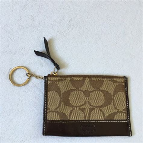 VINTAGE COACH MINI BLACK KEYCHAIN COIN PURSE POUCH ZIP WALLET. Opens in a new window or tab. Pre-Owned. $24.99. 0 bids · Time left 26m. or Best Offer +$5.05 shipping .