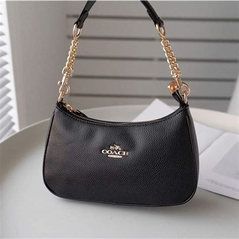 Coach teri bag black. The best way to determine if a Coach bag is authentic is to consider where it was purchased. Coach products are only available at Coach stores, Coach outlet stores, authorized department stores, official Coach websites and authorized third-... 