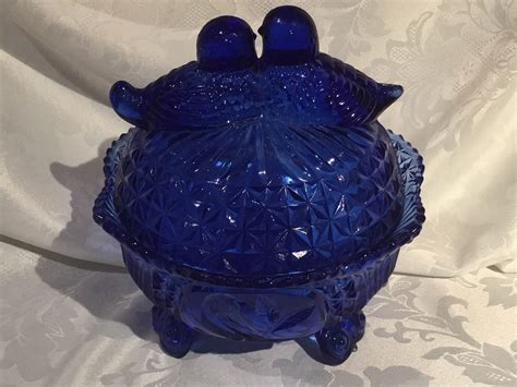 Vintage Cobalt Blue Depression Style Glass Dolphin Covered Candy Dish w/ Lid - Cookie Jar, Art Deco, Vanity Trinket Box, Farmhouse Decor (4.3k) ... FINAL CLEARANCE - 1970s Mosser Summit Glass Aqua Blue "Waffle & Dot" Candy Dish Compote (260) $ 25.80. Add to cart. Loading Add to .... Cobalt blue glass candy dish