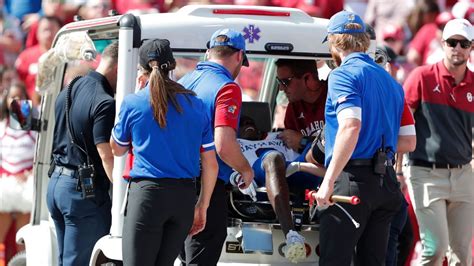 Tough scene in Norman, Oklahoma on Saturday for Kansas football. With just seconds left on the clock before the end of the first half, Jayhawk defensive back Cobee Bryant was injured while stopping a Sooner touchdown. Bryant hurt his leg badly and couldn't get up after the play. The medical staff and cart was brought over to attend Bryant.. 