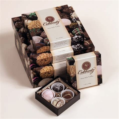 Coblentz chocolates. Description. Make a stunning impression with this beautiful and delicious gift! The Classic Trio includes: 8 oz. Deluxe Assortment. 1 lb. Deluxe Mixed Nuts. 6 pc Mints. During the holiday season (Nov.-Dec.) the holiday wrap is used. Other times of year, the wrap is black and gold. *Props not included in purchase. 