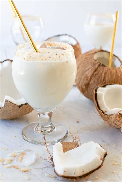 Coconut milk cocktail. Cocktail. Stir together milk and chocolate syrup in the prepared glass. Add coconut rum and dark rum and stir. Leave enough room for ice if desired. Add ice to the glass (optional). Top with whipped cream, toasted coconut, and mini chocolate chips. 