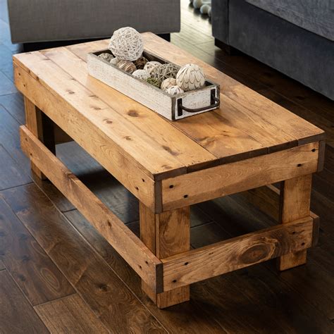 Coffee table solid wood. Bring a piece of the countryside to your home. This coffee table, made from reclaimed solid wood with eye-catching turned legs, is rendered in a brownish-gray hue, perfect for living areas in need of a rustic touch. It looks at home in a variety of aesthetics, from traditional to coastal to modern farmhouse-inspired. Measuring 20'' H x 42'' L x 42'' W, its sizable width makes it a … 