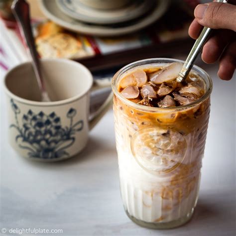 Coffee yogurt. Ingredients. 1/2 cup very strong brewed coffee, cold or at room temperature. 1 tablespoon sweetened condensed milk. Ice cubes. 1/3 cup Vietnamese-Style Homemade Yogurt. Directions. Pour... 