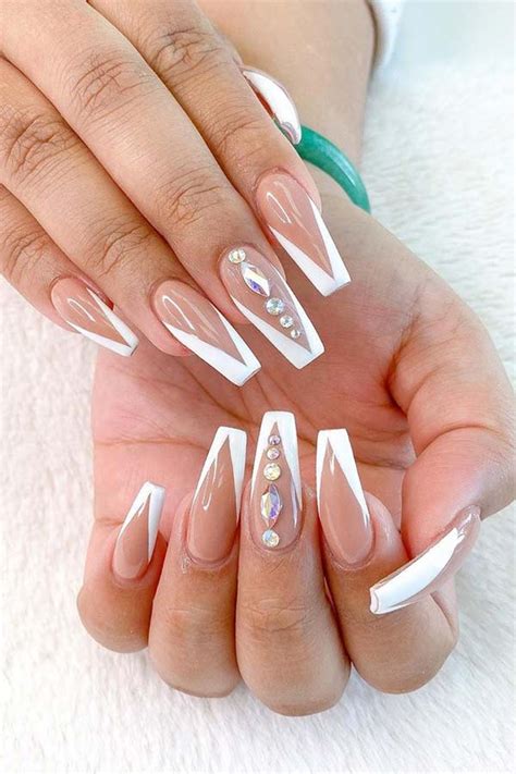 Save to. Credit: Instagram/fiina_naillounge. If you want a really cool and unique look for white coffin nails, this 3-D nail art with clear nails and white polish is a lot of fun. Paint your nails with clear polish and then do a marble art design with white polish. You can use rhinestones to bling it up a bit.