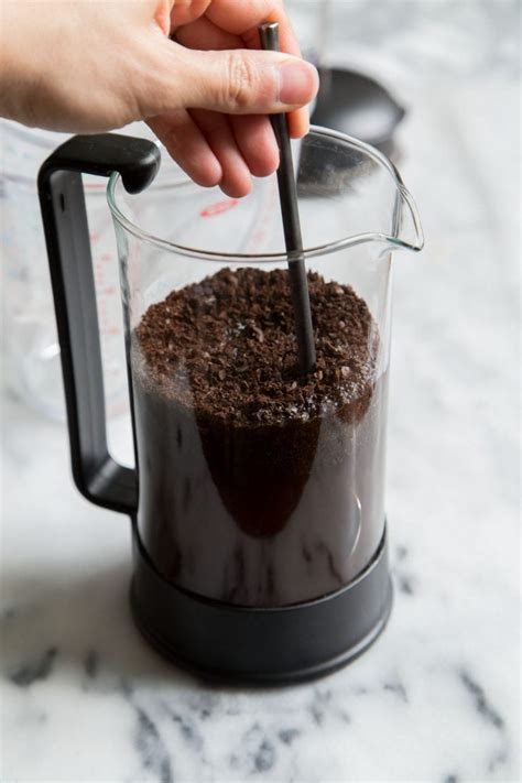 Cold brew coffee concentrate. Grind the coffee beans on the coarsest setting on your grinder, or in short 1-second pulses in a spice grinder. The grounds should look like coarse cornmeal, not fine powder. You should have just under 1 cup of grounds. Transfer the coffee grounds to the container you're using to make the cold brew. 