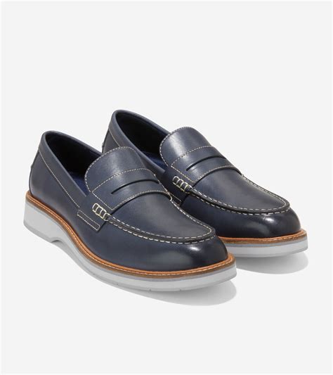 Freshen up your shoe collection with the Grand Atlantic Penny Loafer from Cole Haan. This leather slip-on features GRAND.ØS technology throughout for flexible, cushioned steps. Stitching around the moc-style toe and a penny keeper strap add notes of tradition to this pair. Item # 501886. UPC # 194736406622.. 