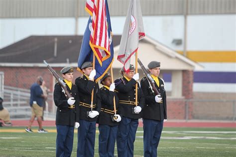 The photo above shows a tribal color guard and in front of the team are the bearers of Eagle Feather Staffs. These staffs are considered to be at the same level as a national flag. ... My question lies with the correct order of precedence when carrying the flag of an American Indian nation flag in company with the US and state flags. I assume .... 