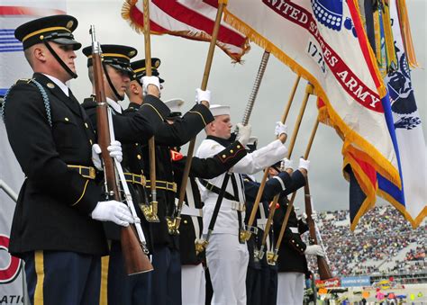 Guard, consisting of at least 7 riflemen, 2 Color Bearers carrying the American Flag (and organization flag, if any), and 2 organization members to raise the Flag, be marched to the flagpole. (A 150‐foot distance is recommended, although this will vary as …. 