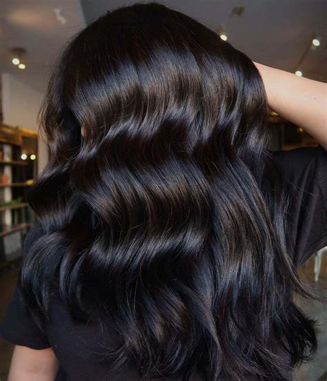 Color in black hair. 10. Long Red Waves. Save. One of the easiest ways to style red ombre on black hair is to start with a few red highlights on top which flow all the way down. Your hair appears like a soft yet edgy mixture of black and red. Use the curling iron to get long, sensual waves. 11. 