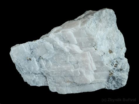 Carbonate of calcium and magnesium. Colors: Often pinkish or flesh colored, but sometimes white, gray, green, brown or black. ... Slightly harder than calcite.. 