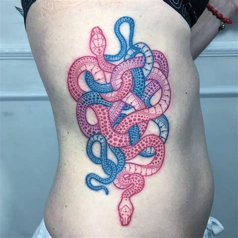 Colorful snake tattoos on the right side.