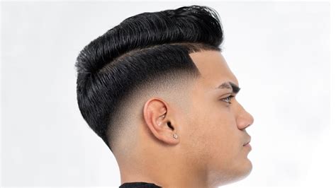 Follow the indications below when getting the hairstyle and you’ll have a remarkable look. 1. Asian Pompadour. Combining the famous pompadour with a low drop fade will get you a slick, shiny look that complements your look. By using a razor to style the temples, you’ll obtain a neat, stylish look that stands out. 2.. 