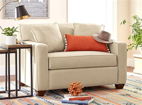 Comfortable sofa bed. SPECIFICATIONS: This convertible sofa is made from premium-quality polyester and has a solid hardwood frame construction. The sofa measures 66.1" W x 33.1" D x 29.5" H. The bed measures 66.1" W x 37.6" D x 15.1" H. CARE INSTRUCTIONS: Vacuum occasionally, and use the soft brush attachment to remove particles. Spot clean prior to a full clean. 
