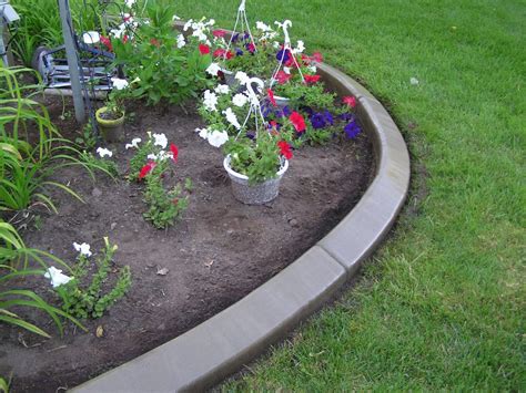 Concrete flower bed edging. Colmet 8-ft x 4-in Brown Powder Coat Steel Landscape Edging Section. Col-met 8 ft. steel landscape edging keeps a clean line between grass and flower beds. This brown powder-coated steel edging resists frost heave and comes with four (4) removable stakes to join sections together and to anchor edging into the ground. 