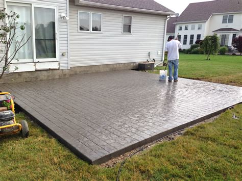 Concrete for patio. Concrete is one of the most durable and hard-wearing surfaces available and provides a sturdy foundation for a range of building projects. ... Most building codes require concrete patio slabs to be laid at a minimum thickness of 3.5 inches with a compressive strength of 3,000 PSI. Given the industry standard for residential properties is four ... 