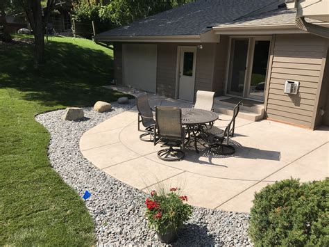 Concrete patios ideas. Exposed aggregate patio pros and cons. As mentioned above, the pros of an exposed aggregate patio area are the aesthetics, slip resistance, hiding surface imperfections, durability, and reasonable cost. Like anything, though, there are potential downsides. 
