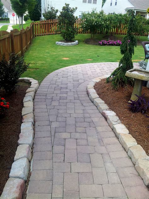 Concrete paver patio. Rundle Stone pavers come in two sizes: 12 in. x12 in. and 12 in. x 24 in. slabs and are 1.5 in. thick. Once installed the pavers can be left to naturally age with time and weather or can be sealed with a concrete sealant in order to enhance and protect the original colors. This two piece system is easily installed. 