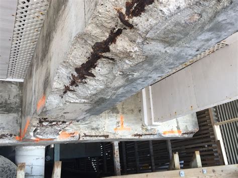 Concrete spalling. As an example, concrete spalling from the corner of a foundation is common due to the different expansion and contraction characteristics of many building ... 