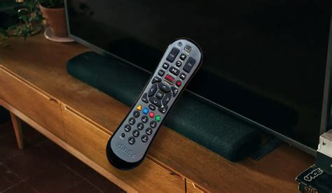 Control soundbar volume with tv remote.  You can set up your Xfinity remote...