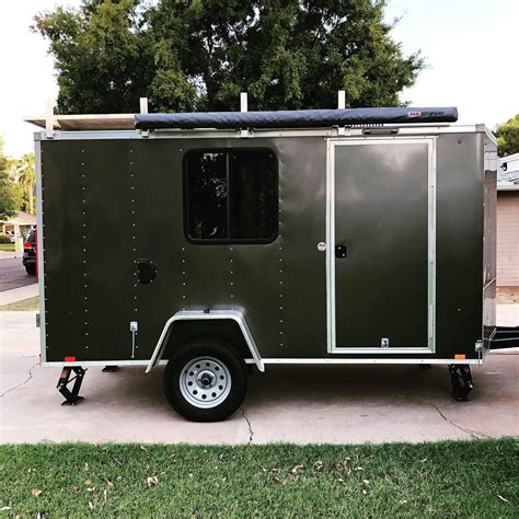 Converted cargo trailers for sale. This one was listed as a "gypsy tiny home" and it was converted out of a 2001 Turnbow 95. It features many over-the-top decor fixtures and comes with a number of features. Some of its features include: a king size sleeping loft, full size dresser, and sofa. And there's even a fireplace, display cabinets, writing desk, and more! 