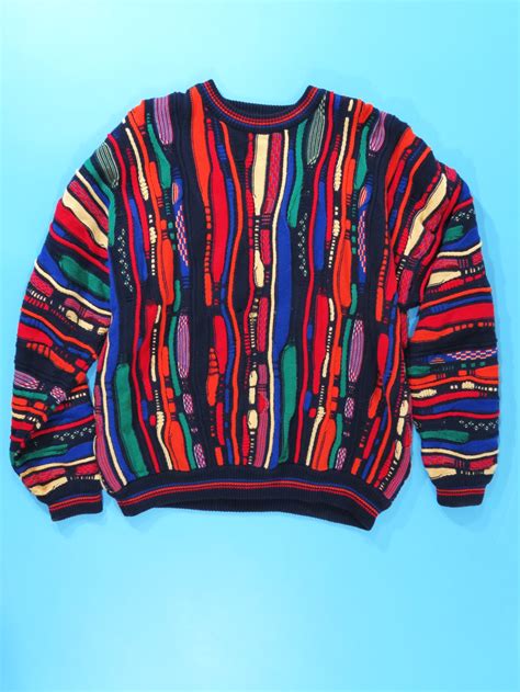 Coogi style sweater. This is a vintage item from 1990s, made by Coogi and popularized mostly via Biggie Smalls. It is constructed of very soft, mercerised cotton yarn-which ... 