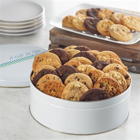 Cookie tin. 3 Christmas Cookie Tins- Christmas Cookie Tins with Lids for Gift Giving, Christmas Tins Holiday Cookie Boxes, Christmas Tins for Cookies and Gifts- 3 Nested Metal Cookie Tins (Metal Tins) 4.2 out of 5 stars. 238. 100+ bought in past month. $18.99 $ 18. 99 ($6.33 $6.33 /Count) List: $24.00 $24.00. 