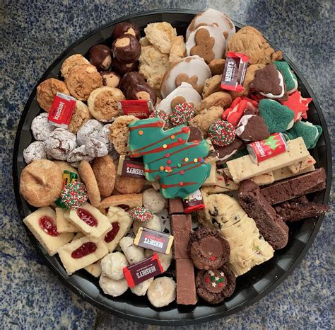 Cookie tray cookies. Our Italian cookie trays are great to give as gifts or to bring to the next office/holiday party. They come with an assortment of Wholly Cannoli’s famous Italian cookies: Anisette, Lemon, Cherry, Ricotta, Pistachio, Pizzettes, Vanilla Butter Balls, & Chocolate Butter Balls. Trays are wrapped in cellophane with your choice of colored ribbon. 