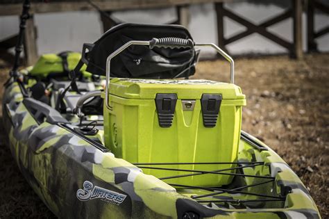 Cooler on kayak. Seconded for soft sided cooler. Ice Mule makes several that are fairly easy to fit on a kayak. They're designed to work similar to a dry bag, folding down from the top. Their medium size will hold a 12 pack and you can get it for around $40-60 depending on the shop. 