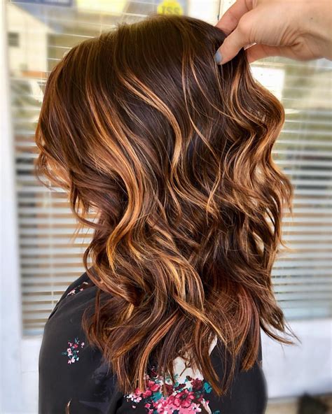 Copper highlights on dark brown hair. #1. Silver Streaks on Dark Brown Hair. Gray hair isn’t just for your grandma anymore. No, it’s a hot new trend that’s taken the hairstyling world by … 