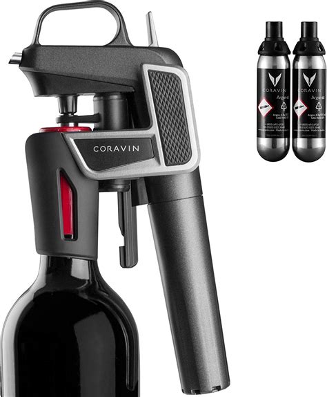 Coravin wine preserver. Product shot of a Coravin Model Five Wine Preservation System pouring red wine into a wine. Two women toasting with a glass of red wine and a glass of white ... 