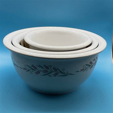 Stoneware Casseroles: 2-1/2qt -2.37 L Casserole Dish with Lid 1-1/2qt - 1.42 L Casserole Dish with Lid Brand: Corelle Pattern: Chutney Made in China The larger bowl measures 11.5” across, 4” deep. The smaller bowl measures 9” across, 4” deep. Features: Dishwasher, Microwave, refrigerator, freezer safe. 